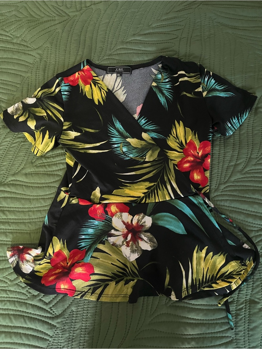 Vibe Black Floral Wrap Top with Red & Green Accents